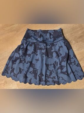 aerie Offline skirt with shorts underneath in Navy Floral Print with scallop